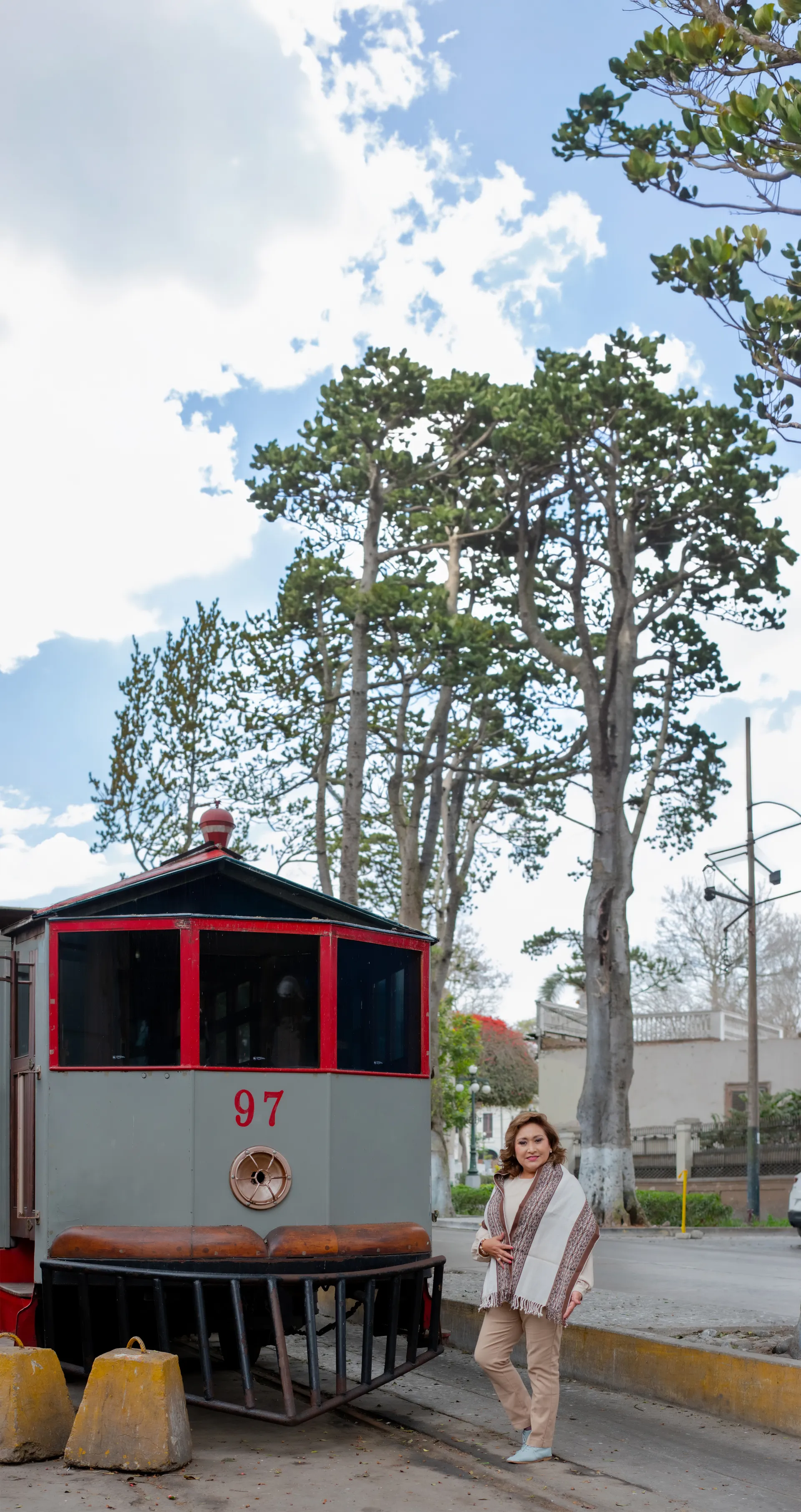 Dalila Gamarra, founder of Alpaca Culture, by a classic Peruvian trolley